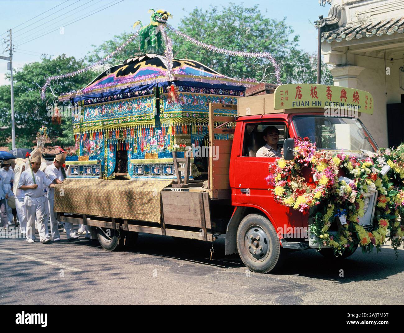 Malaysia. Malacca. Chinese funeral procession. Flower decorated lorry. Stock Photo