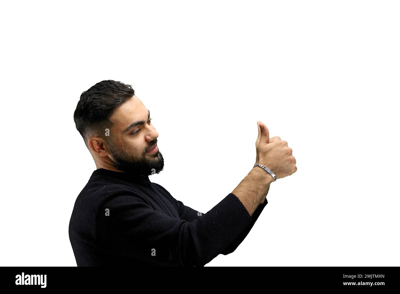 A man, close-up, on a white background, shows his thumbs up Stock Photo