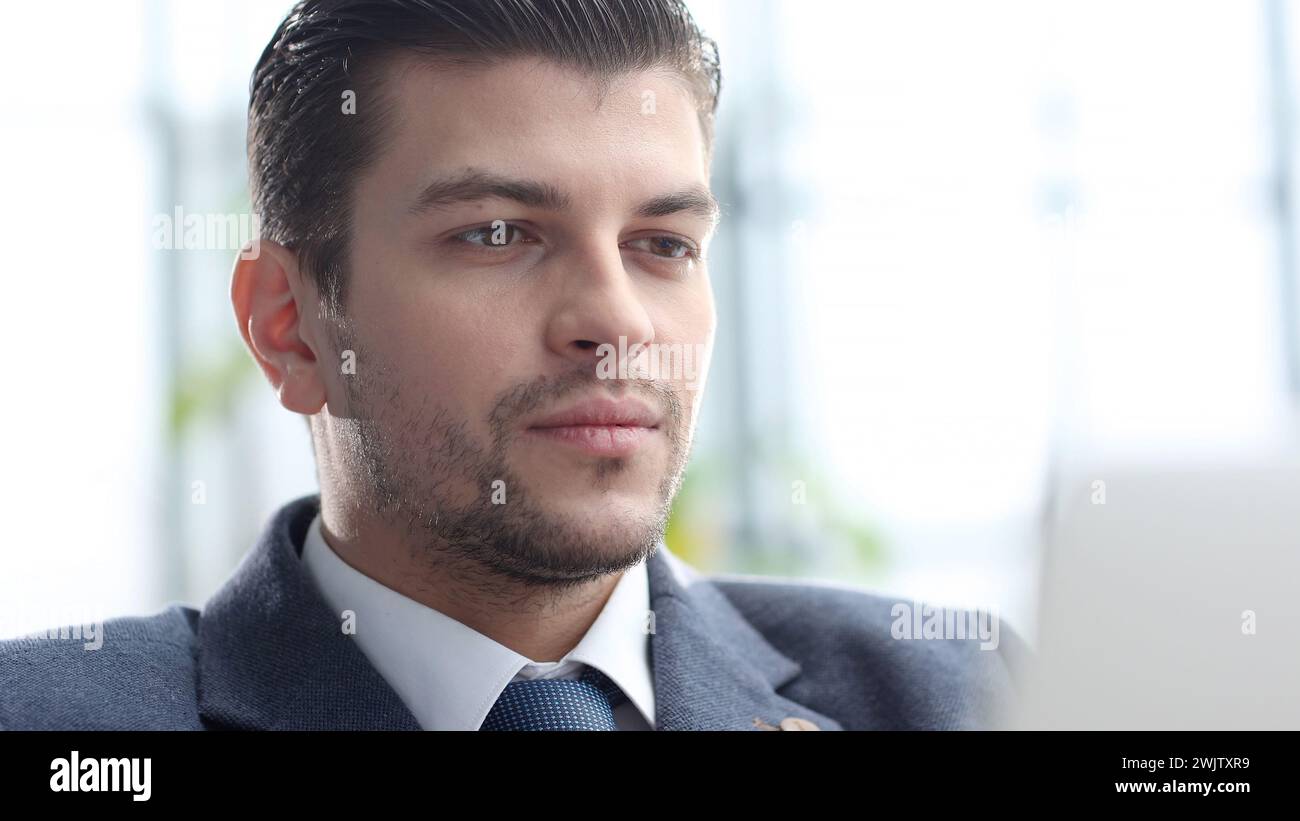 A male businessman works in an office Stock Photo
