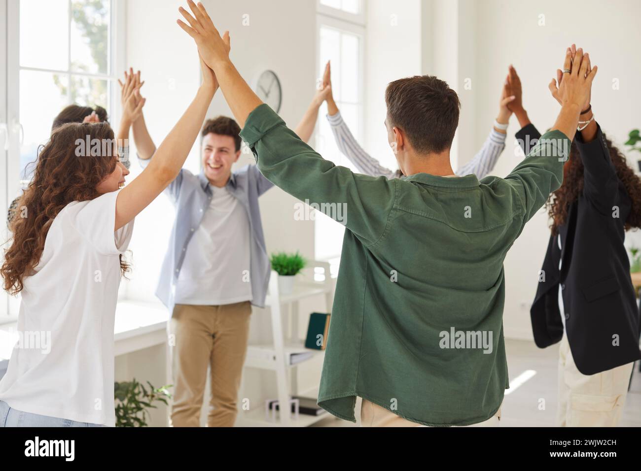 Group of happy diverse teenage boys and girls make friends and have fun at school Stock Photo