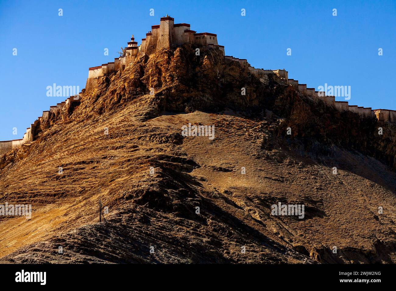 Gyantse Fortress or Gyantse Dzong is one of the best preserved dzongs in Tibet, located high above the historic  town of Gyantse on a huge spur of gre Stock Photo