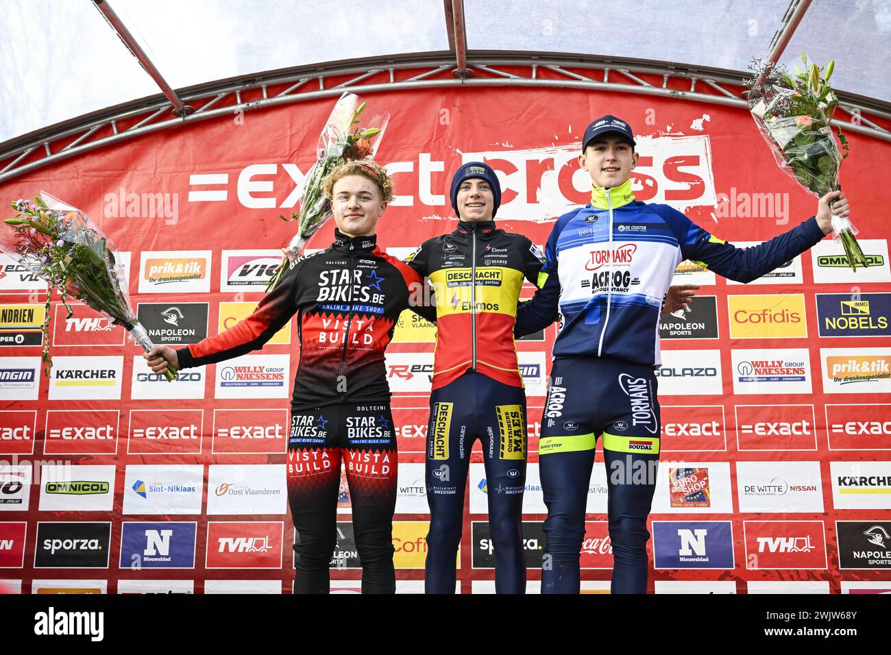 Sint Niklaas, Belgium. 17th Feb, 2024. Winner Belgian Giel Lejeune, second place Belgian Brent Lippens and third place Seppe Sprangers pictured on the podium after the men's second year nieuwelingen race of the 'Waaslandcross' cyclocross cycling event, race 7/7 in the 'Exact Cross' competition, Saturday 17 February 2024 in Sint-Niklaas. BELGA PHOTO TOM GOYVAERTS Credit: Belga News Agency/Alamy Live News Stock Photo