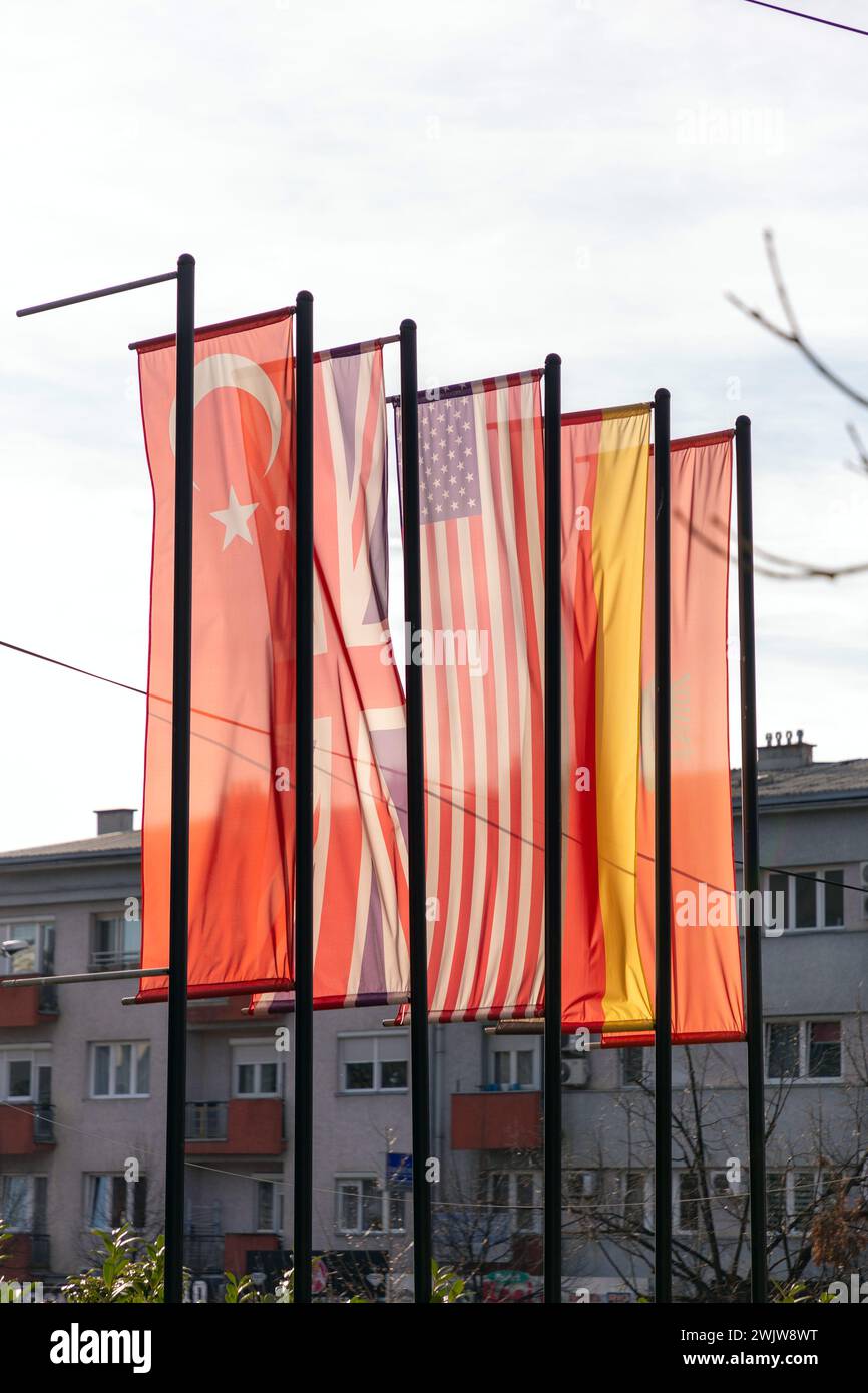 Pristina, Kosovo - February 5, 2024: Flags of Turkiye, UK, USA, Germany, and Albania in the streets of Pristina, the capital of Kosovo. Stock Photo
