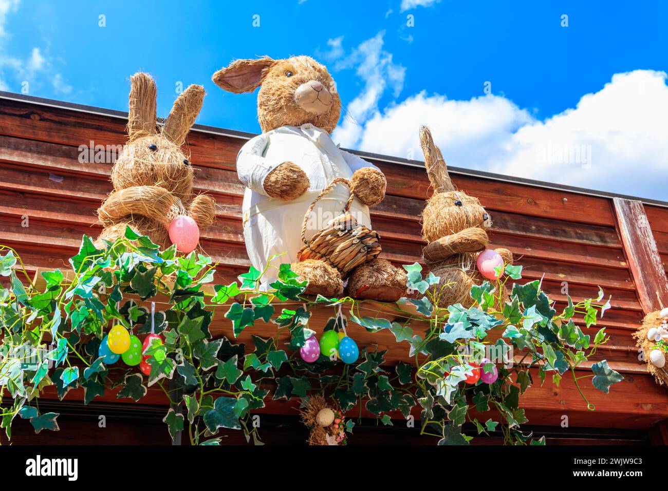 Easter decoration with Easter bunnies and Easter eggs on a house Stock Photo