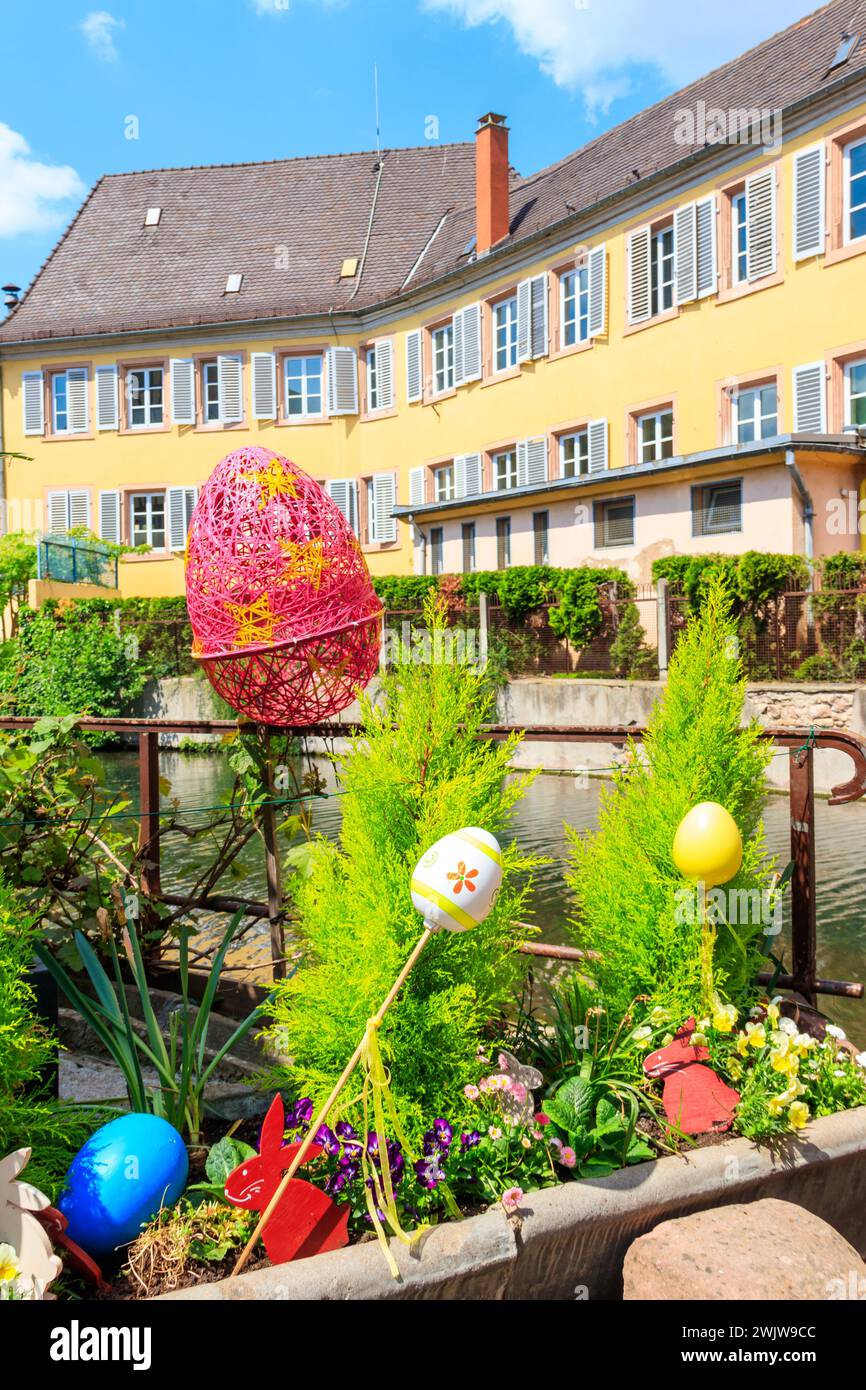 Flowerbed with flowers and Easter decoration at spring Stock Photo