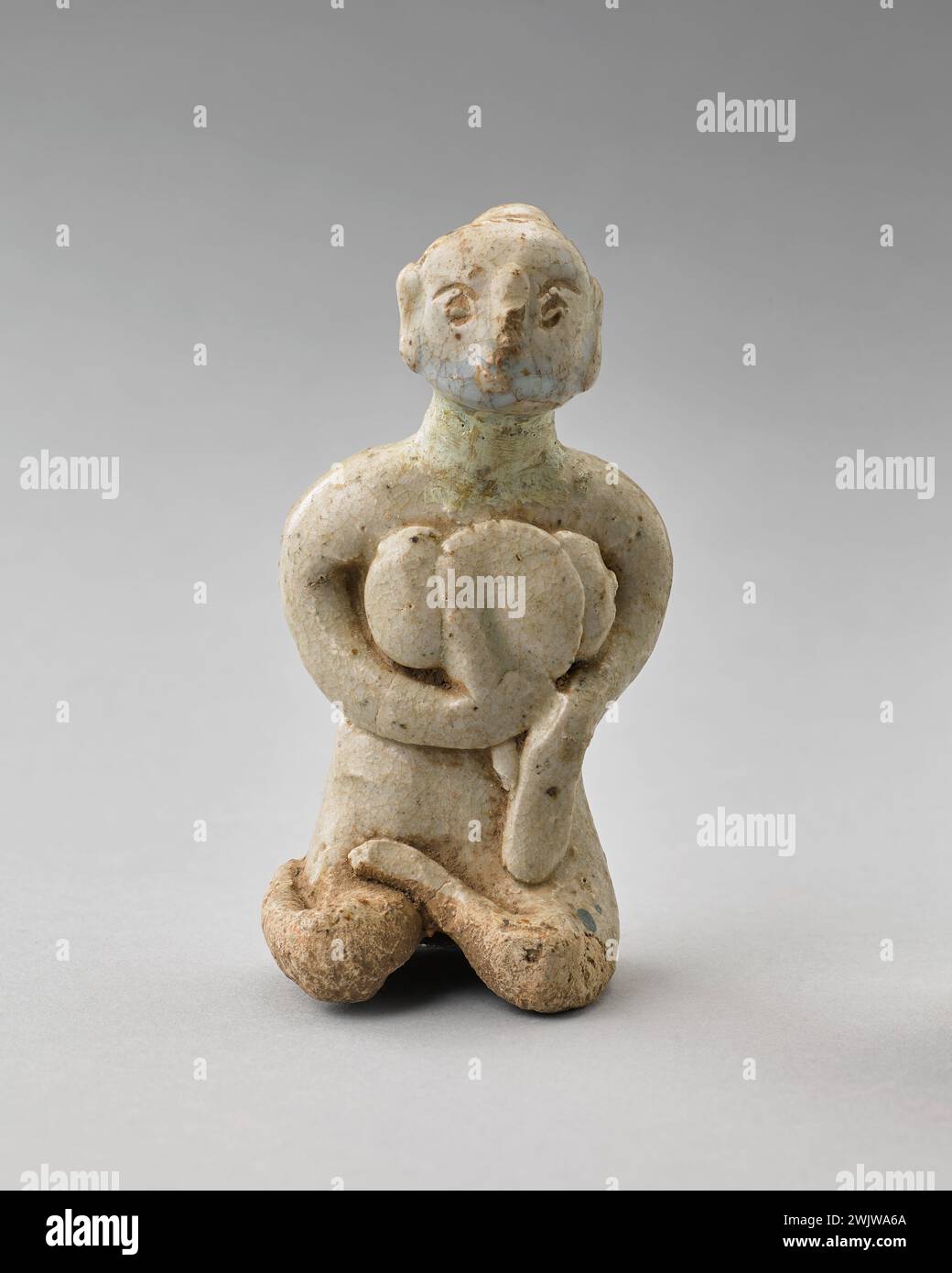 Statuette (usual name), 1400. Covered sandstone. Cernuschi Museum, Asia