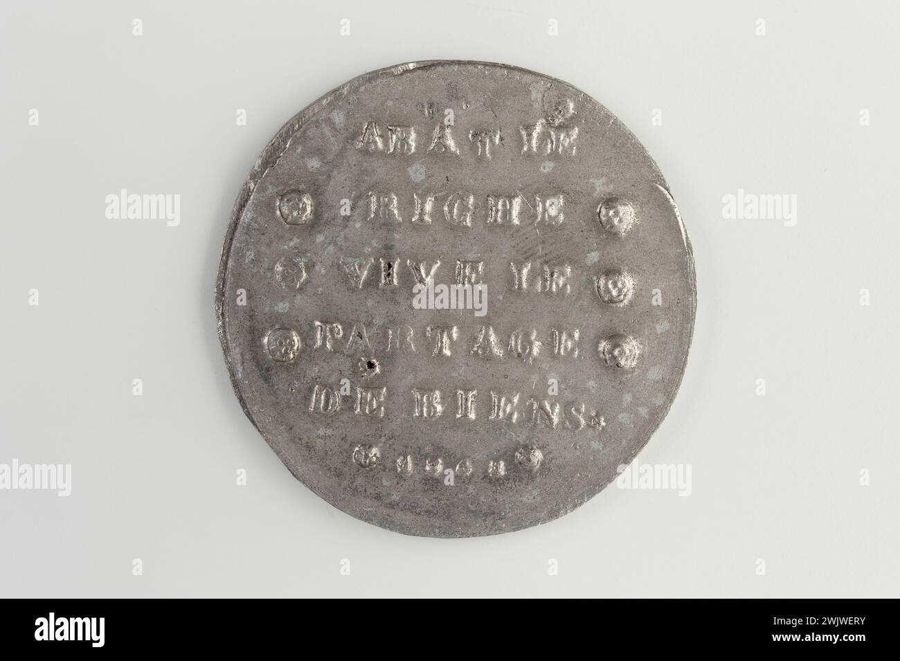 Carnavalet museum, medal collection Right registration on six lines, scored on both sides of skulls; Reverse inscription on four lines above three dead heads in staggered care surrounding the Lille inscription. Stock Photo