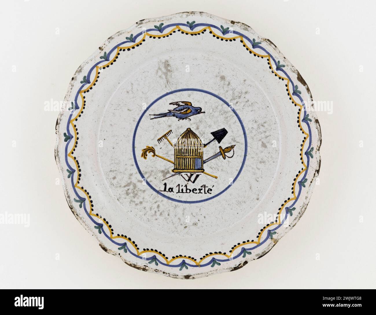 Anonymous. 'W Liberty' plate. Earthenware. Paris, Carnavalet museum. 71683-6 Decoration, Epee, Faience, Liberte, Revolutionary Periode, Rateau, French Revolution, Plate Stock Photo