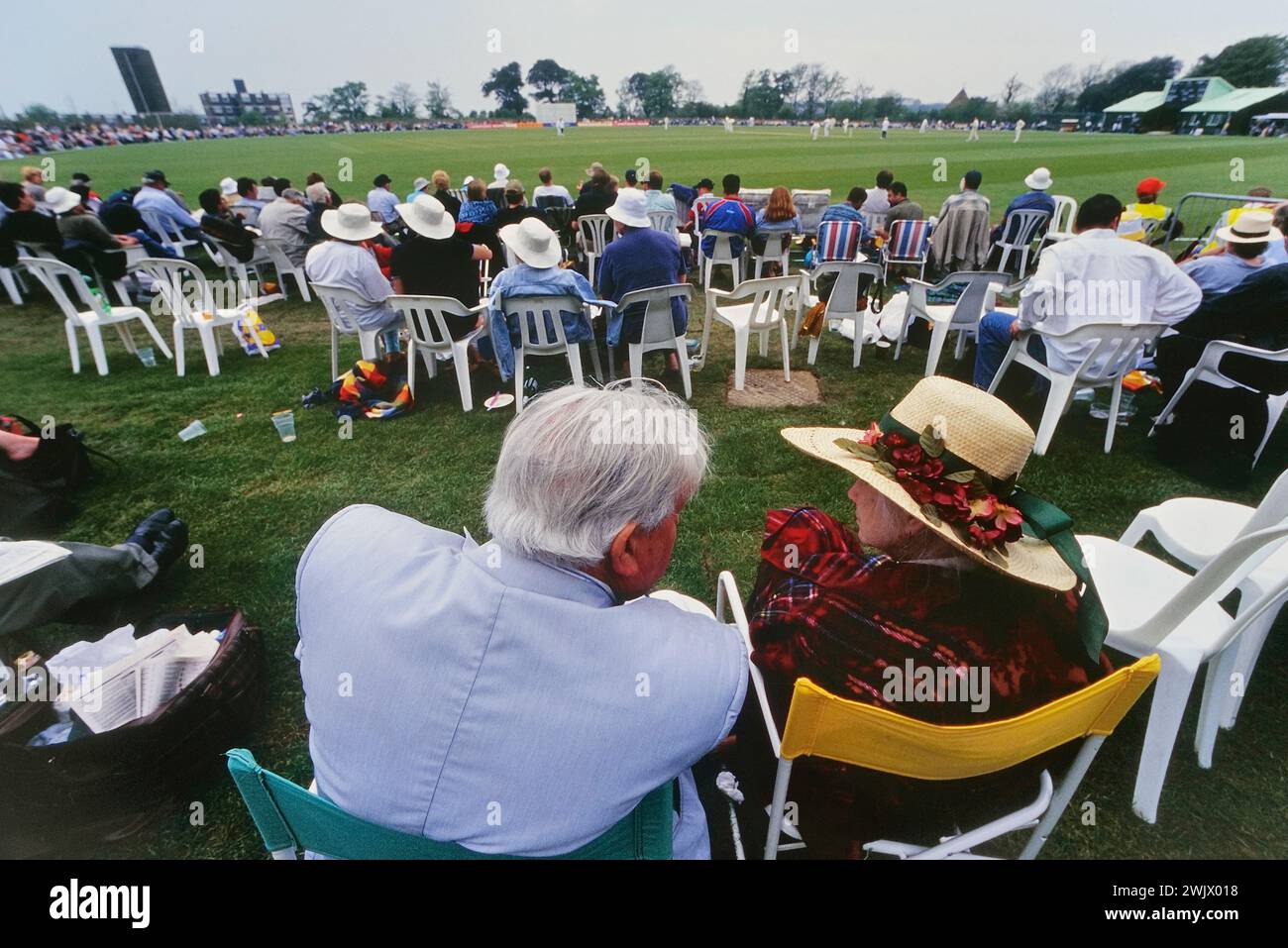 Cricket spectators watching a one day match between Sussex CCC v Zimbabweans at Horntye Park, Hastings. East Sussex. England. UK. May 07, 2000 Stock Photo