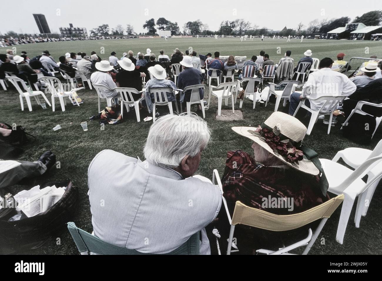 Elderly cricket spectators watching a game at Horntye Park, Hastings. East Sussex. England. UK. May 07, 2000 Stock Photo