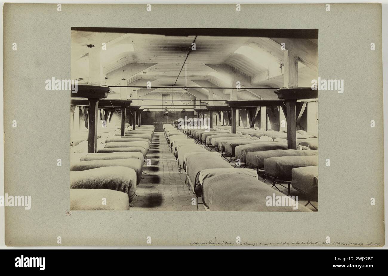 Emonts or Emonds, Pierre. House of St Lazare - Gr. Dormitory. Girls detained by administrative measure - 110 beds under the attic - South side building -. 'Large dormitory of the girls detained by administrative measure, prison of Saint-Lazare, 10th arrondissement, Paris'. Albumin paper. in 1888-1888. Paris, Carnavalet museum. 144177-16 Stock Photo