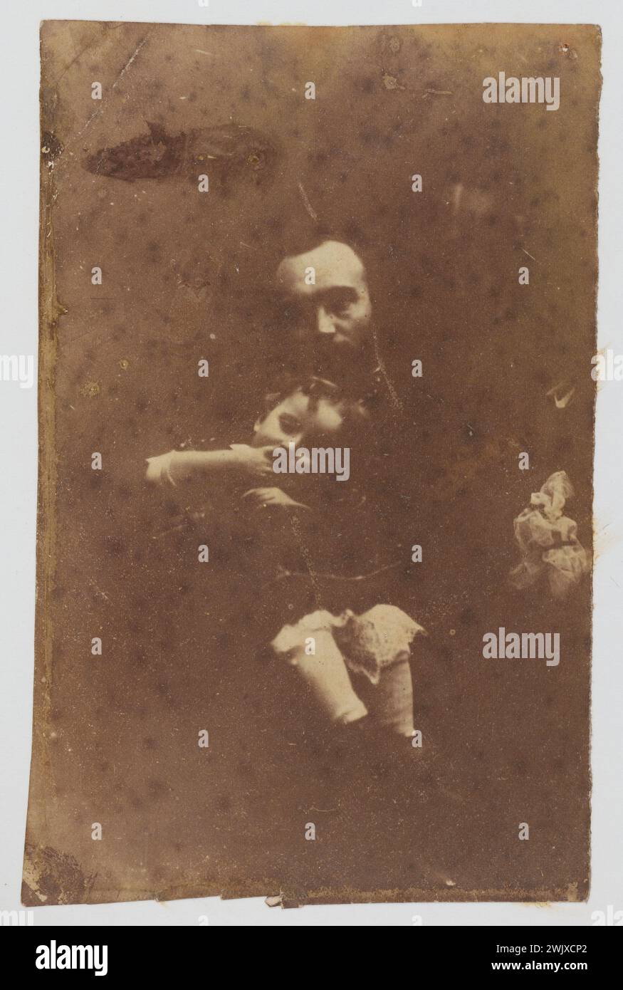 JOSS or album Nicolle album (having belonged to Joséphine Nicolle, sister-in-law of the proscribed Bonnet-Duverdier). Edouard Guillaume Bonnet-Duverdier and his daughter Marguerite. Photography on salted paper. Author: Atelier de Jersey, 1852-1855. Paris, house of Victor Hugo. 53635-14 Album Joss, album Nicolle, exile, family, girl, French politician, dirty paper, father, proscribed, portrait, 19th XIX 19th 19th 19th 19th century Stock Photo