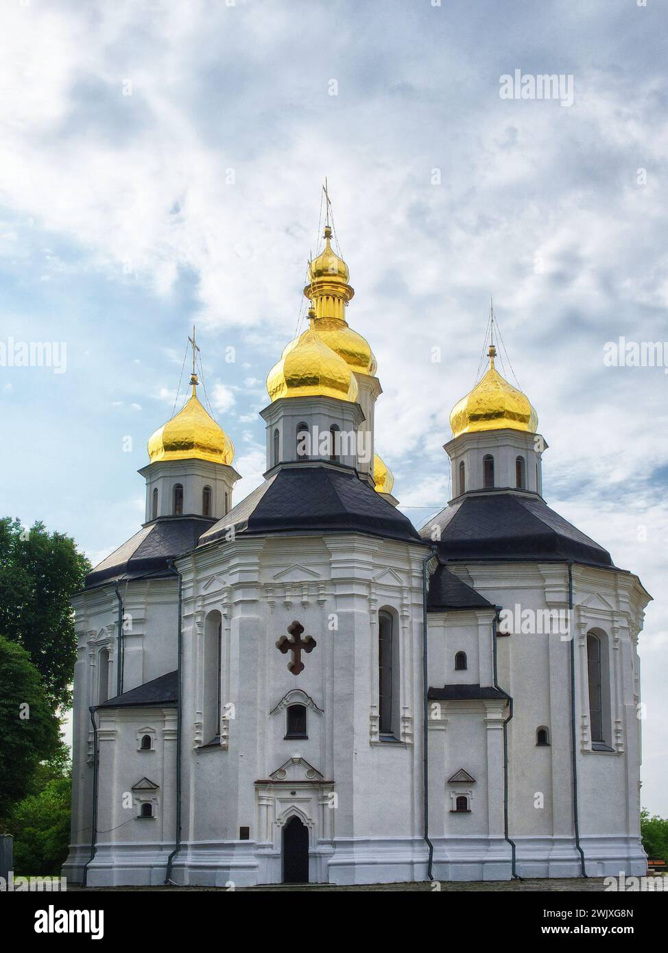 The golden domes of Catherine's Church are a beacon of splendor against the backdrop of Ukrainian Baroque architecture, with its white facade and five Stock Photo