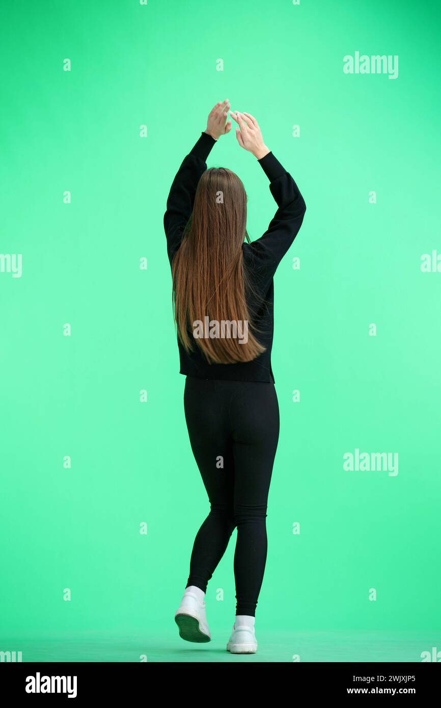 Young woman dancing in yellow hi-res stock photography and images - Alamy