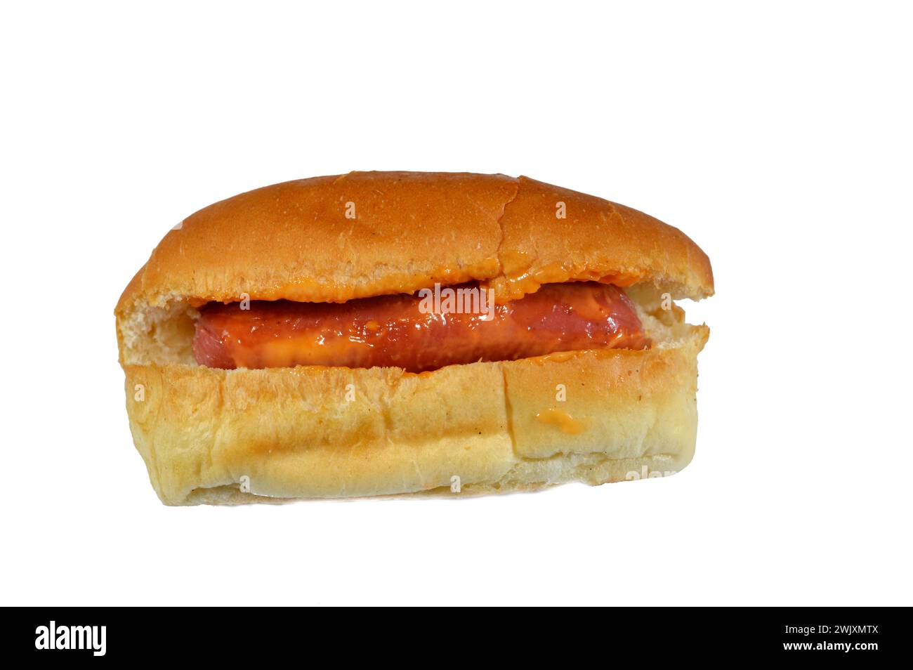hot dog in a bun with thousand island dressing sauce of ketchup