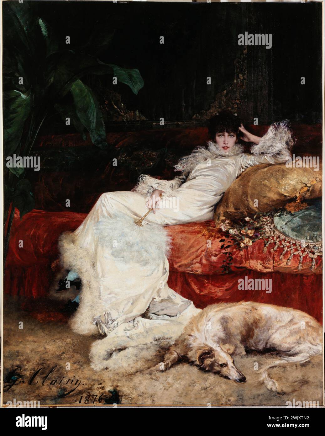 Georges Clairin (1843-1919). 'Portrait of Sarah Bernhardt (1844-1923)', 1876. Museum of Fine Arts of the City of Paris, Petit Palais. 24040-15 French actress, lengthening, lengthening, pet, domestic animal, familiar animal, white, sofa, comedian, divan, in the foot, Eventail, yellow, Afghan levier, furniture, work of art, portrait, long, red, sofa dress , Table, 19th XIXth 19th 19th 19th 19th century, dog, furniture, feather, dress Stock Photo