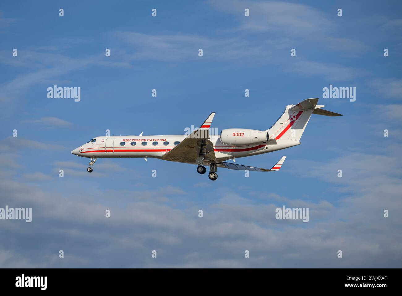 Munich, Germany - February 16. 2024 :  Polish Air Force Gulfstream G550  with the aircraft registration 0002  lands as part of the Munich Security Con Stock Photo