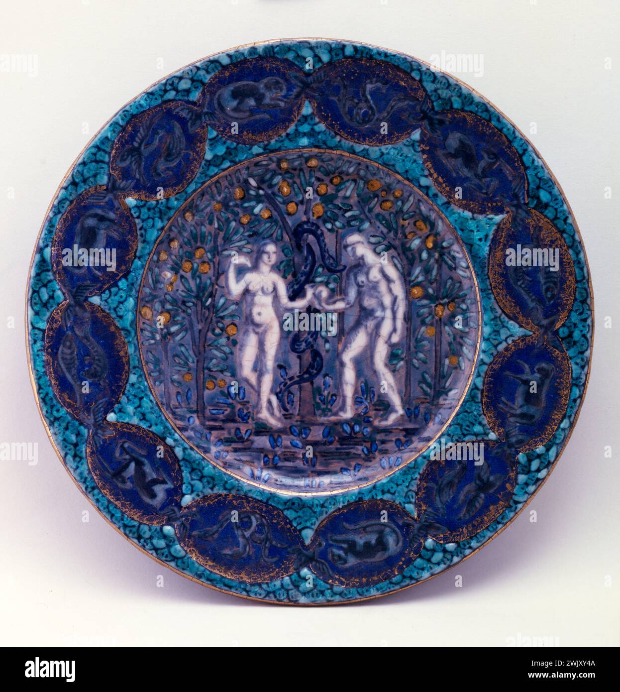André Metthey (1871-1920). 'Adam and Eve'. Earthenware. Museum of Fine Arts of the City of Paris, Petit Palais. Art Menager, Faience, Woman, Man, Eden Garden, Biblical Person, Crockery, 19th 19th 19th 19 19th 19th century, plate, Stock Photo