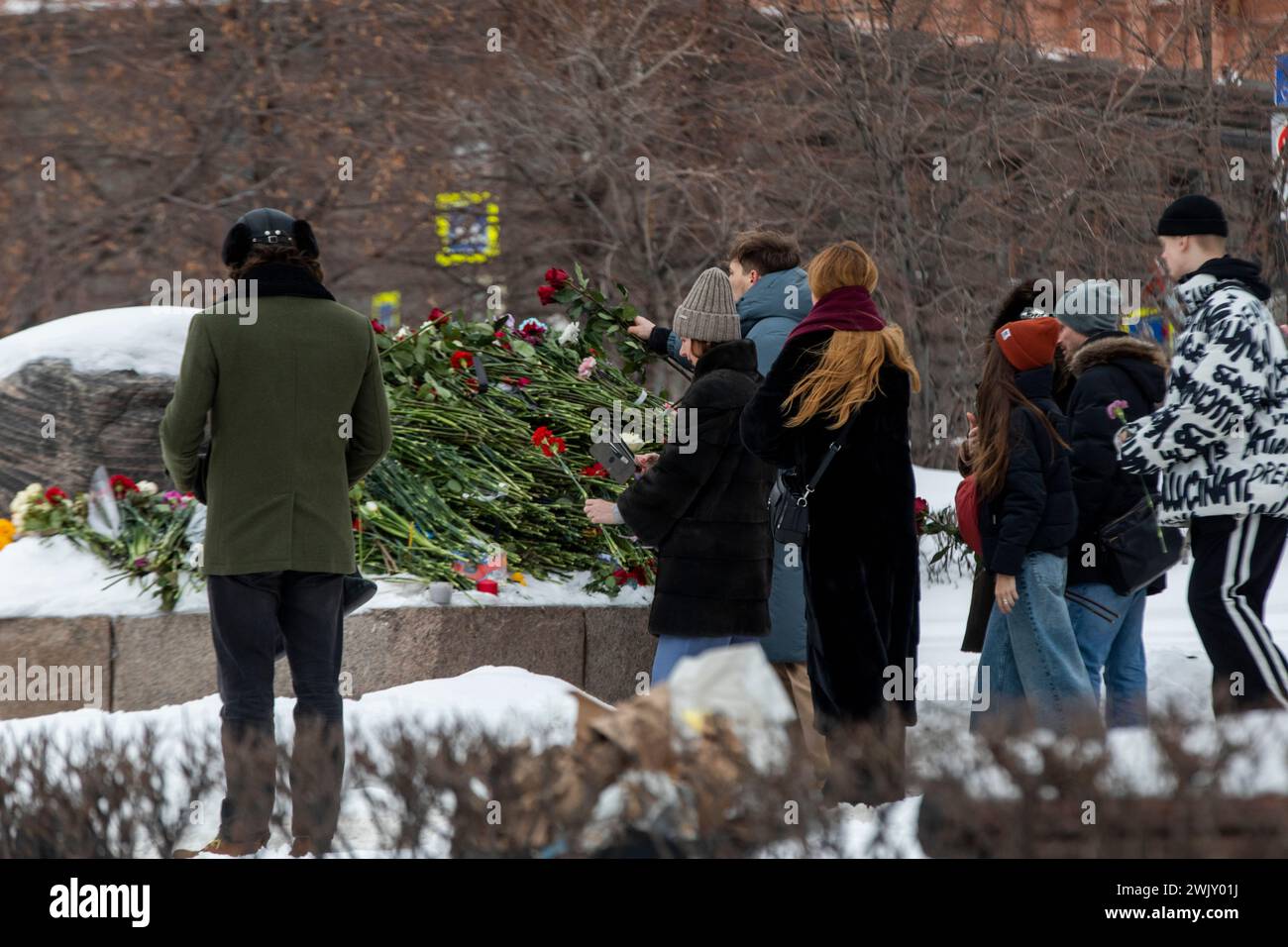 Moscow, Russia. 17th of February, 2024. Some citizens lay flowers at the Solovetsky Stone to commemorate the Russian opposition leader Alexei Navalny after he died in a prison colony where he was serving his sentence, in Moscow, Russia. Credit: Nikolay Vinokurov/Alamy Live News Stock Photo