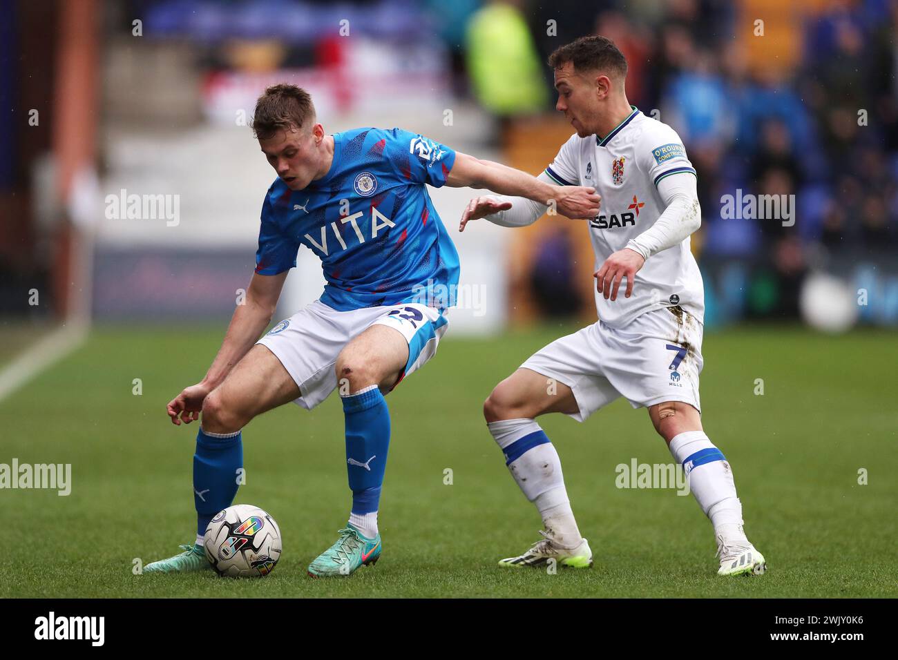 Stockport County's Lewis Cass (left) and Tranmere Rovers' Kieron Morris battle for the ball during the Sky Bet League Two match at Prenton Park, Birkenhead. Picture date: Saturday February 17, 2024. Stock Photo