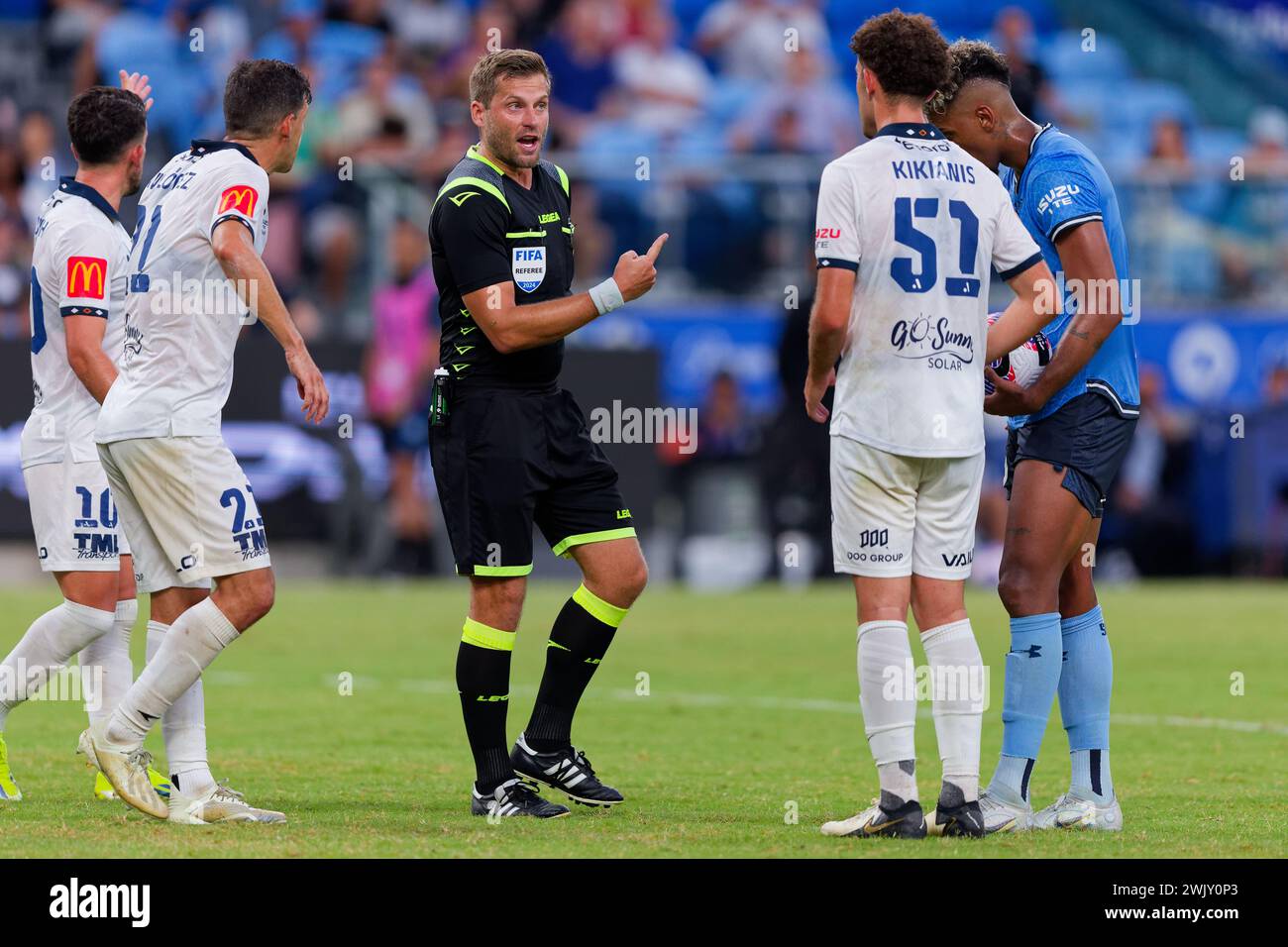 Sydney, Australia. 17th Feb, 2024. Match referee, Alex King speaks to Panagiotis Kikianis of Adelaide United during the A-League Men Rd17 match between Sydney FC and Adelaide United at Alliance Stadium on February 17, 2024 in Sydney, Australia Credit: IOIO IMAGES/Alamy Live News Stock Photo