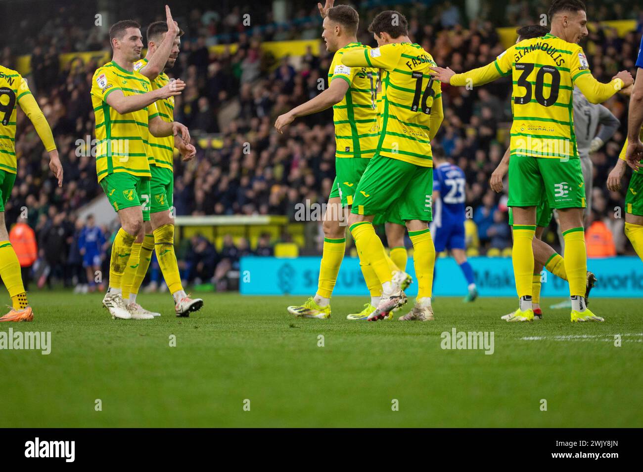 Sydney van Hooijdonk of Norwich City high fives Kenny McLean of Norwich City and Grant Hanley of Norwich City during the Sky Bet Championship match between Norwich City and Cardiff City at Carrow Road, Norwich on Saturday 17th February 2024. (Photo: David Watts | MI News) Credit: MI News & Sport /Alamy Live News Stock Photo
