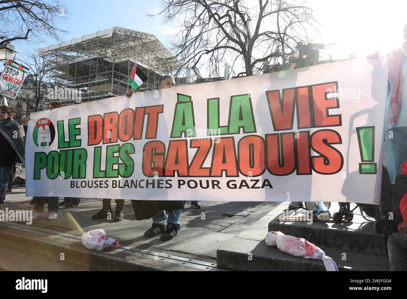Paris, France. 17th Feb, 2024. A palestinian flag and a banner with the ...