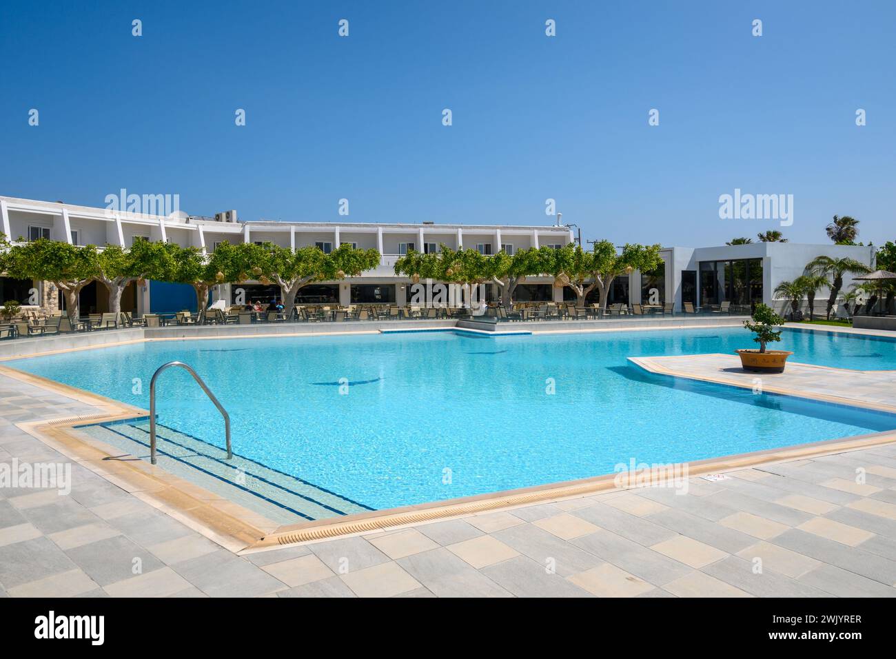 Kos, Greece - May 13, 2023: Pool area of the Sandy Beach hotel, a 4-star resort in Marmari village on the island of Kos. Greece Stock Photo