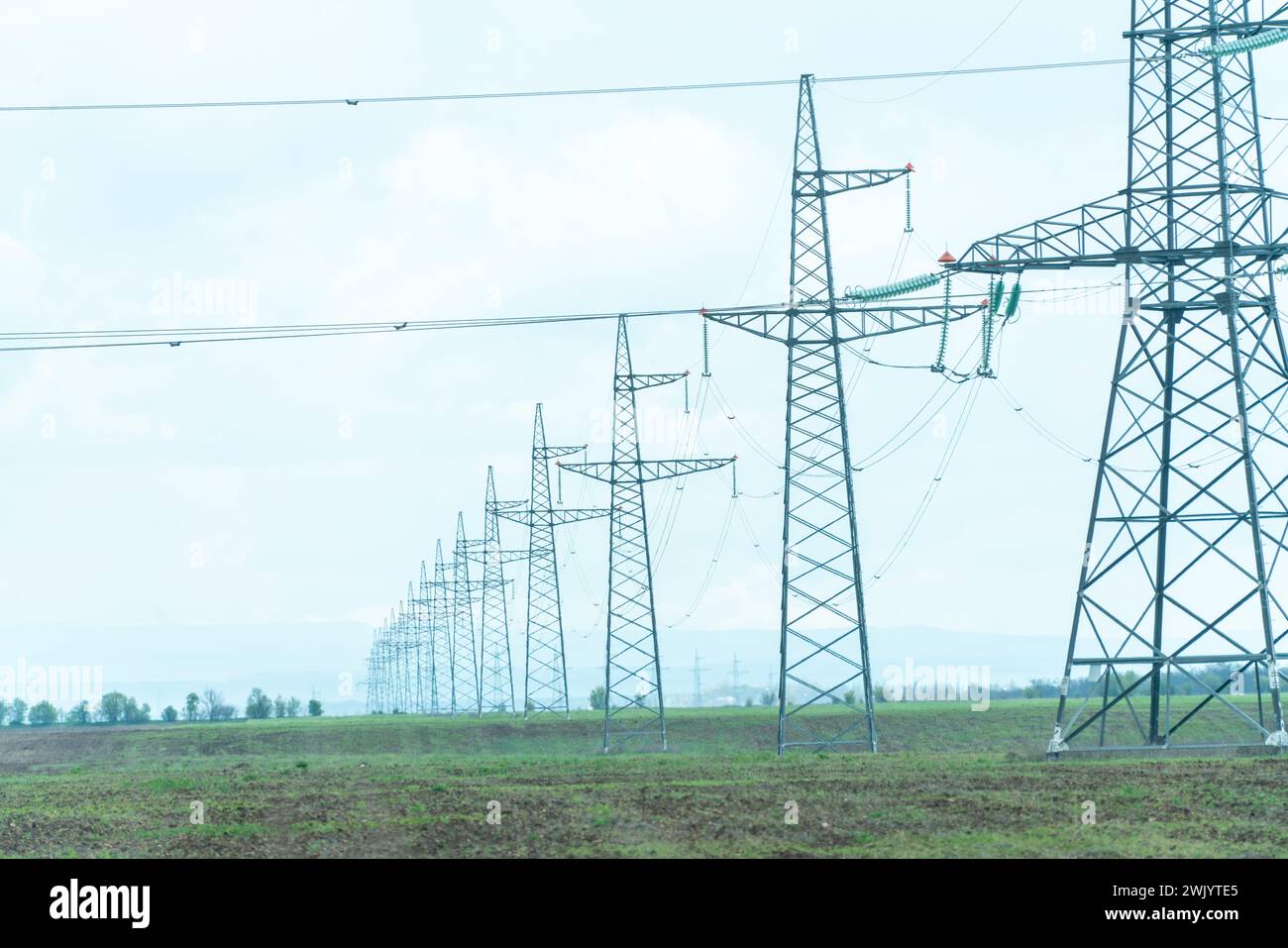 High voltage towers with sky background. Power line support with wires ...