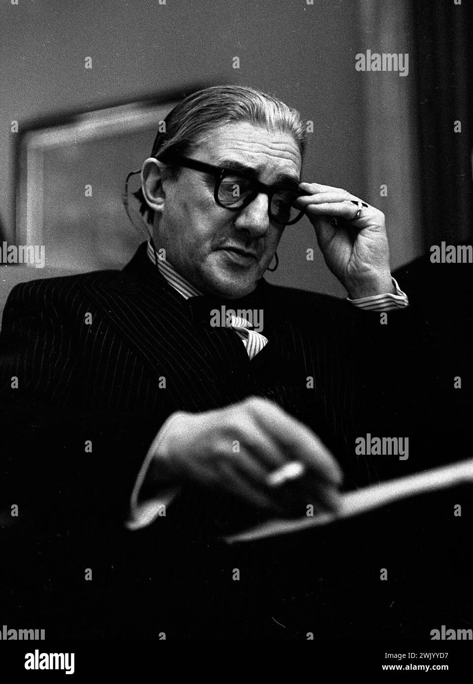 British orchestra conductor John Barbirolli gives a press conference in Buenos Aires, before a performance with the Halle Orchestra at the Teatro Colon, June 28th, 1968. Stock Photo