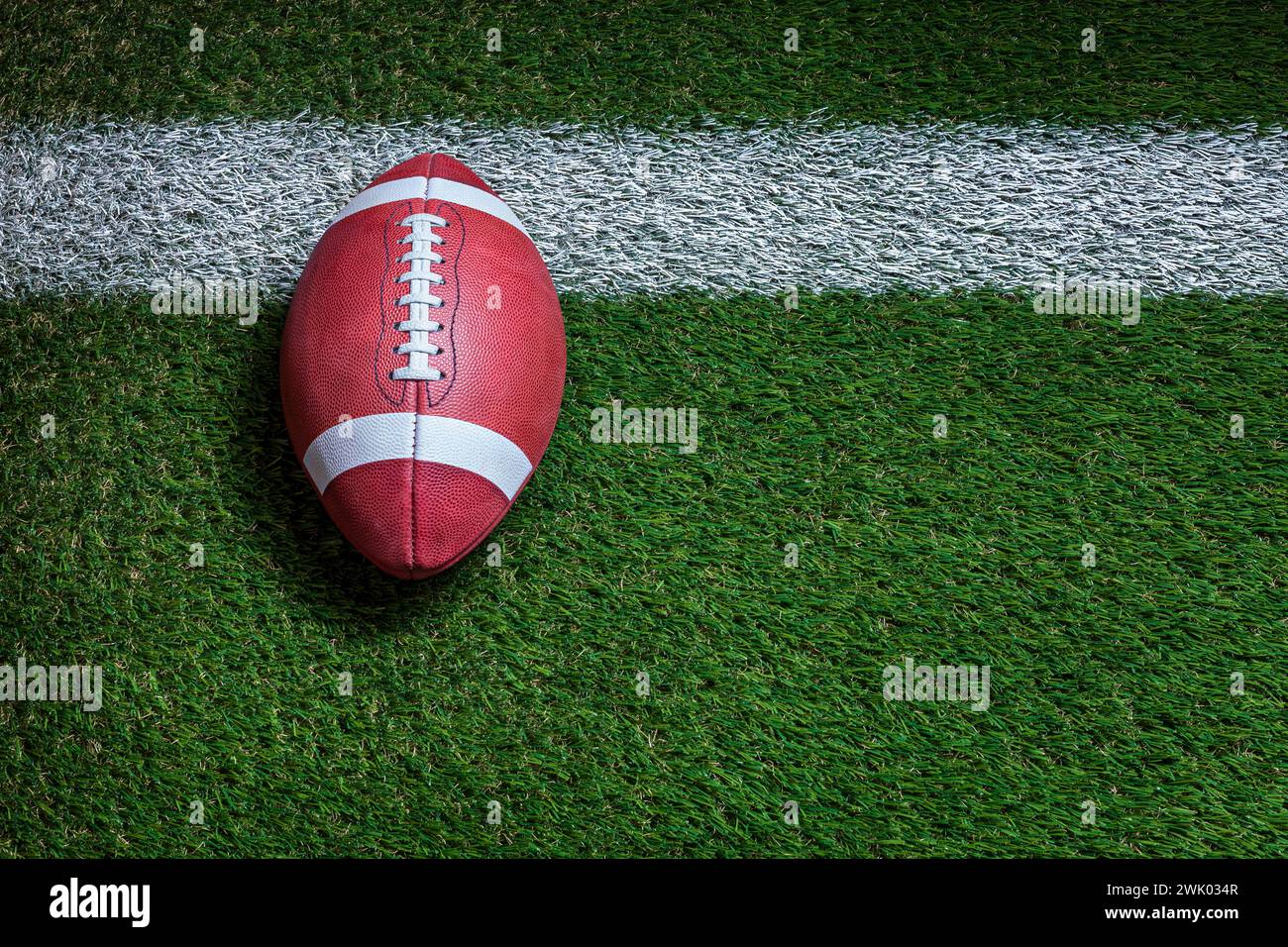 Football at the goal line on a grass field overhead view Stock Photo
