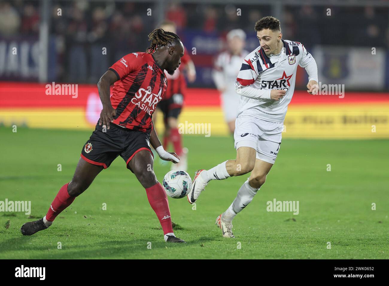Seraing, Belgium. 17th Feb, 2024. Seraing's Marvin Silver Tshibuabua and Liege's Benoit Bruggeman fight for the ball during a soccer match between RFC Seraing and RFC Liege, Saturday 17 February 2024 in Seraing, on day 22/30 of the 2023-2024 'Challenger Pro League' second division of the Belgian championship. BELGA PHOTO BRUNO FAHY Credit: Belga News Agency/Alamy Live News Stock Photo