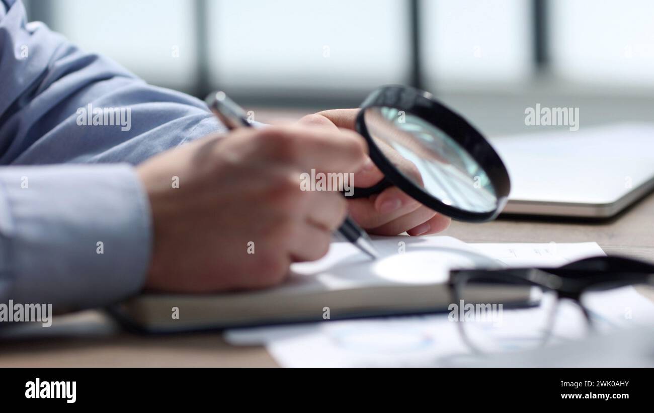Checking documentation and reports for a business report Stock Photo
