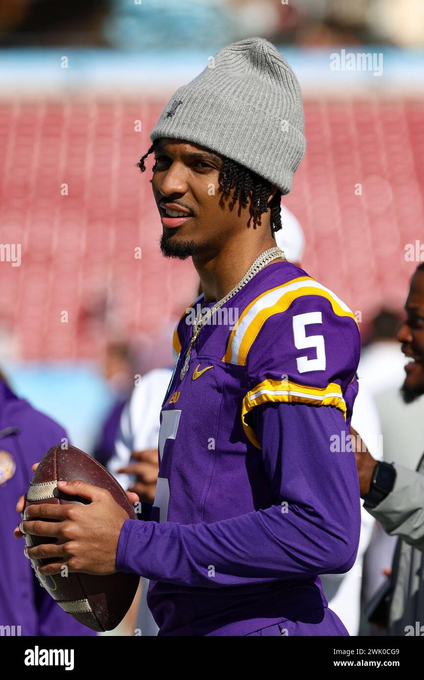 LSU Tigers quarterback Jayden Daniels (5) watches from the sidelines in