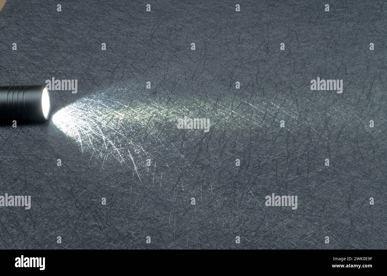 Flashlight shining on a black background. Nice copy space. Stock Photo