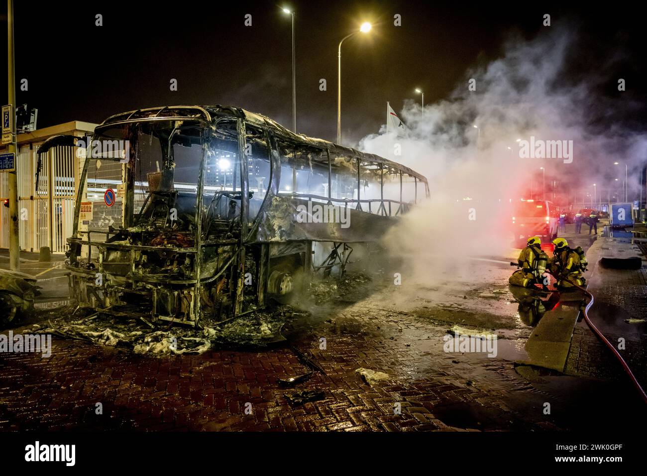 THE HAGUE - Burnt out HTM bus at the Opera hall center on the Fruitweg ...