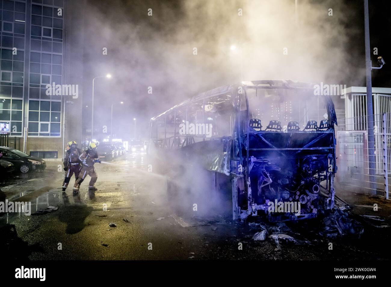 THE HAGUE - Burnt out HTM bus at the Opera hall center on the Fruitweg ...