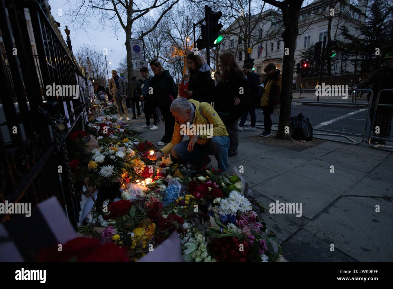 Mourners lay flowers outside the Russian embassy in London for opposition leader Alexei Navalny after confirmation of his death by prison authorities. Stock Photo