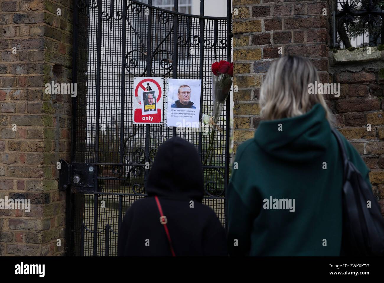 Mourners lay flowers outside the Russian embassy in London for opposition leader Alexei Navalny after confirmation of his death by prison authorities. Stock Photo