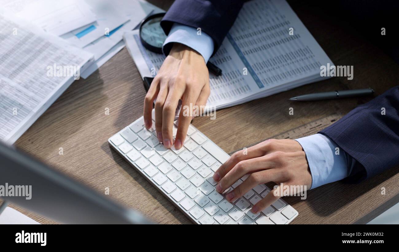 Working in a business center, working at a computer Stock Photo