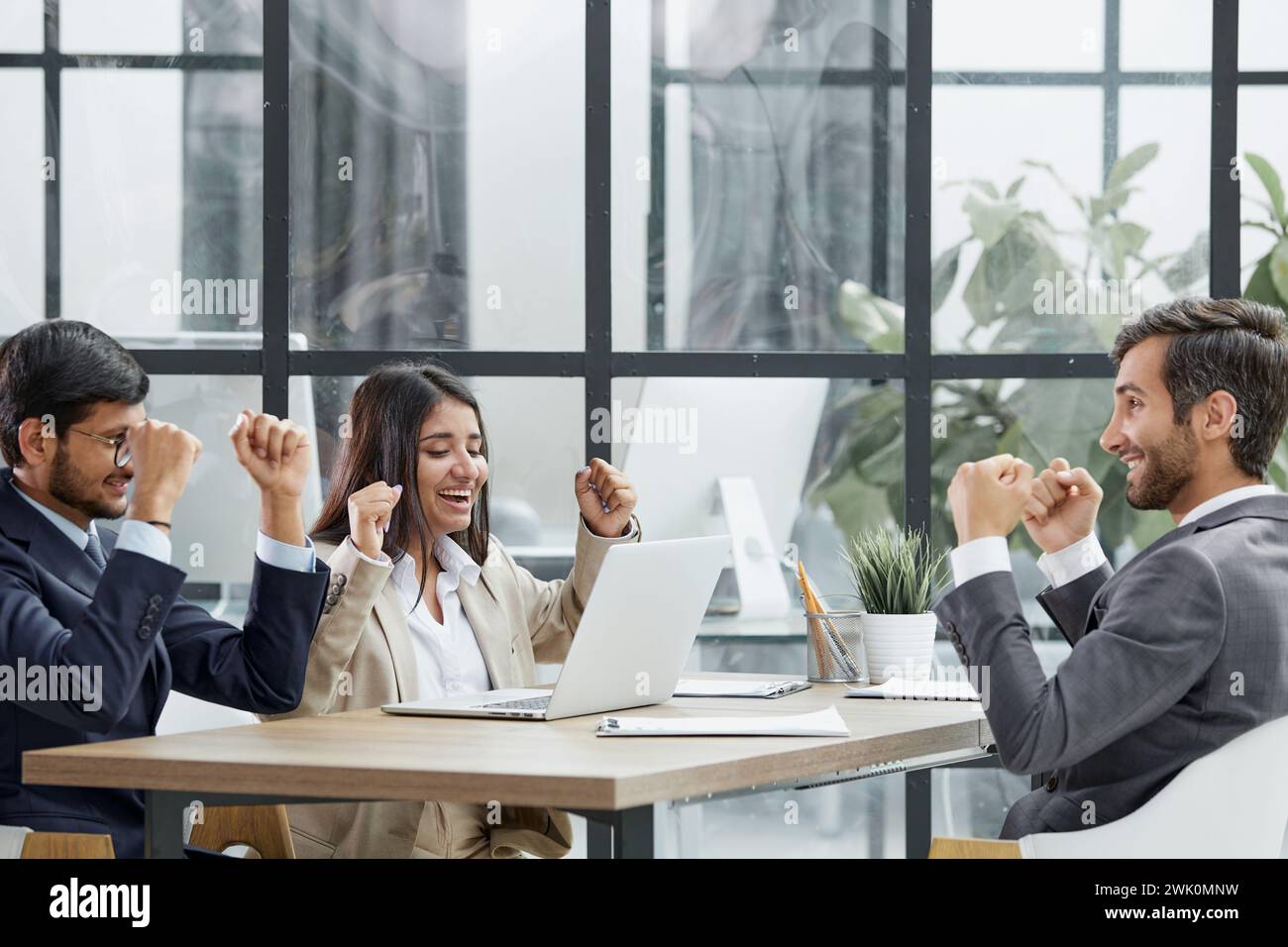 teamwork success win triumph concept at conference table Stock Photo