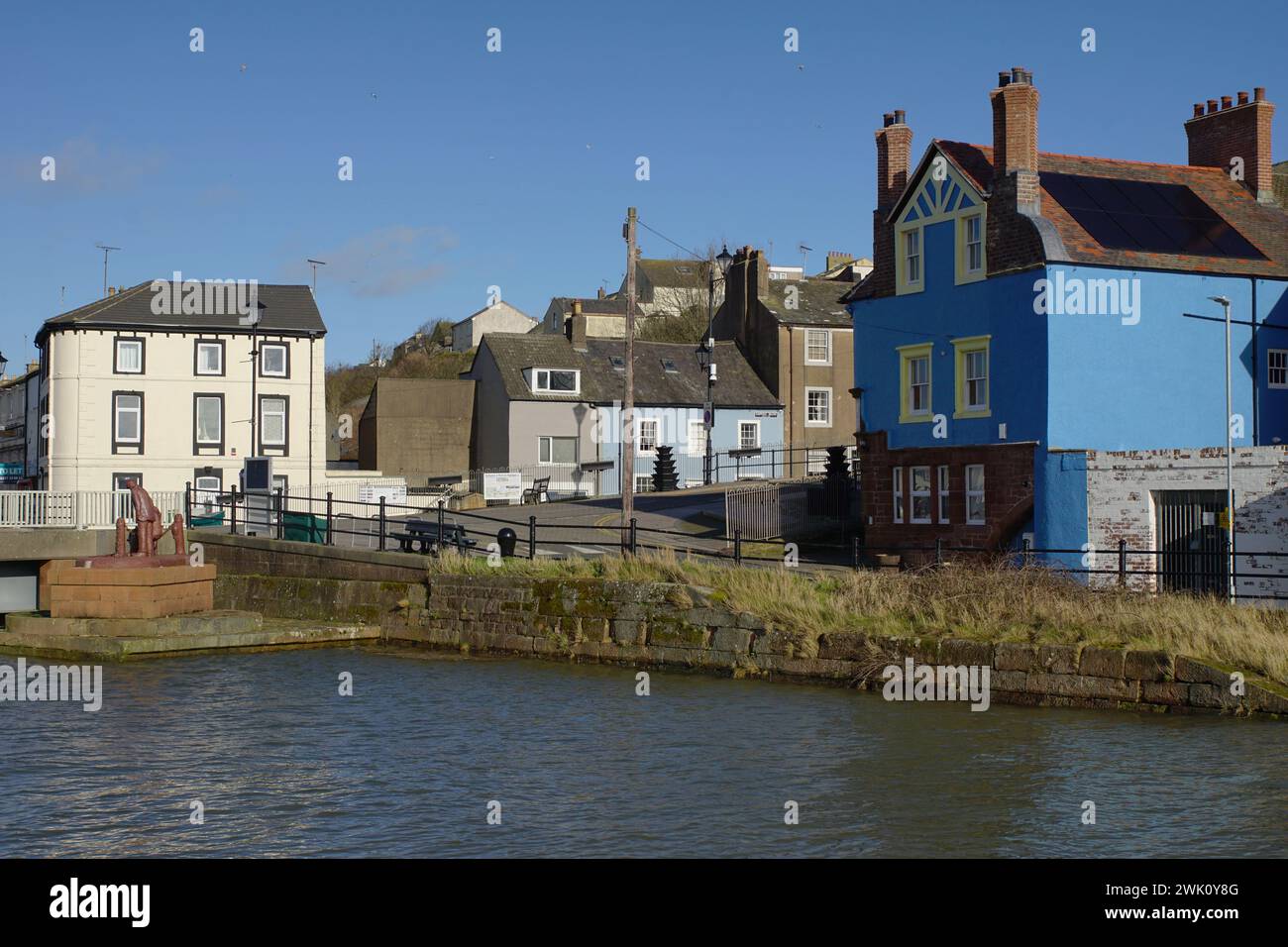 The River Ellen with 'a fishy tale' sculpture at Maryport Cumbria, UK Stock Photo