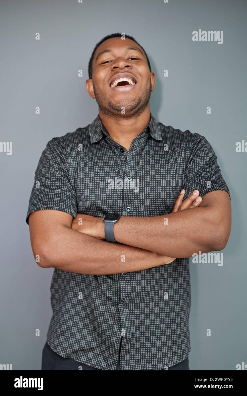 Portrait of an attractive cool guy on a gray background Stock Photo