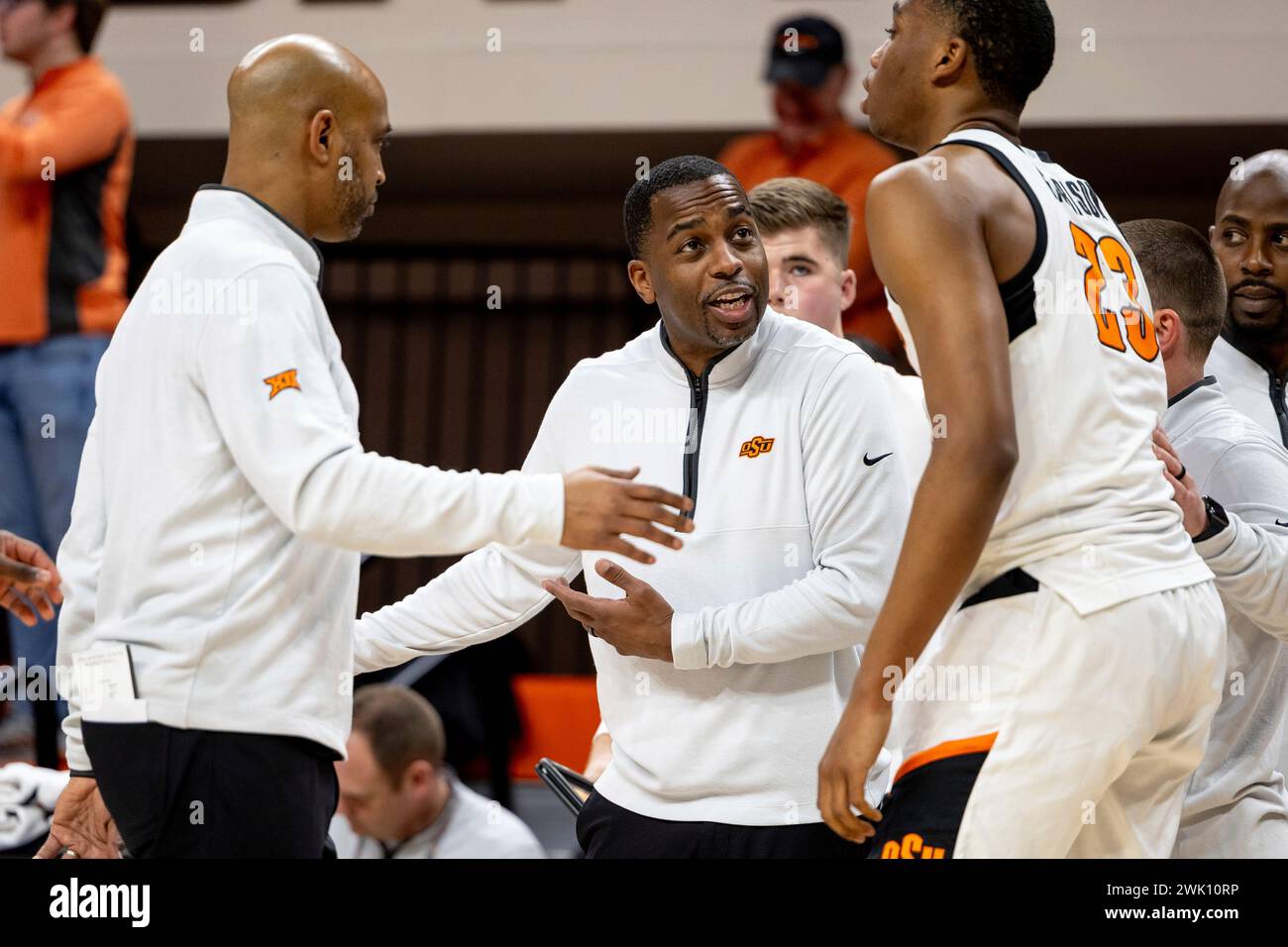 Oklahoma State head coach Mike Boynton talks with center Brandon