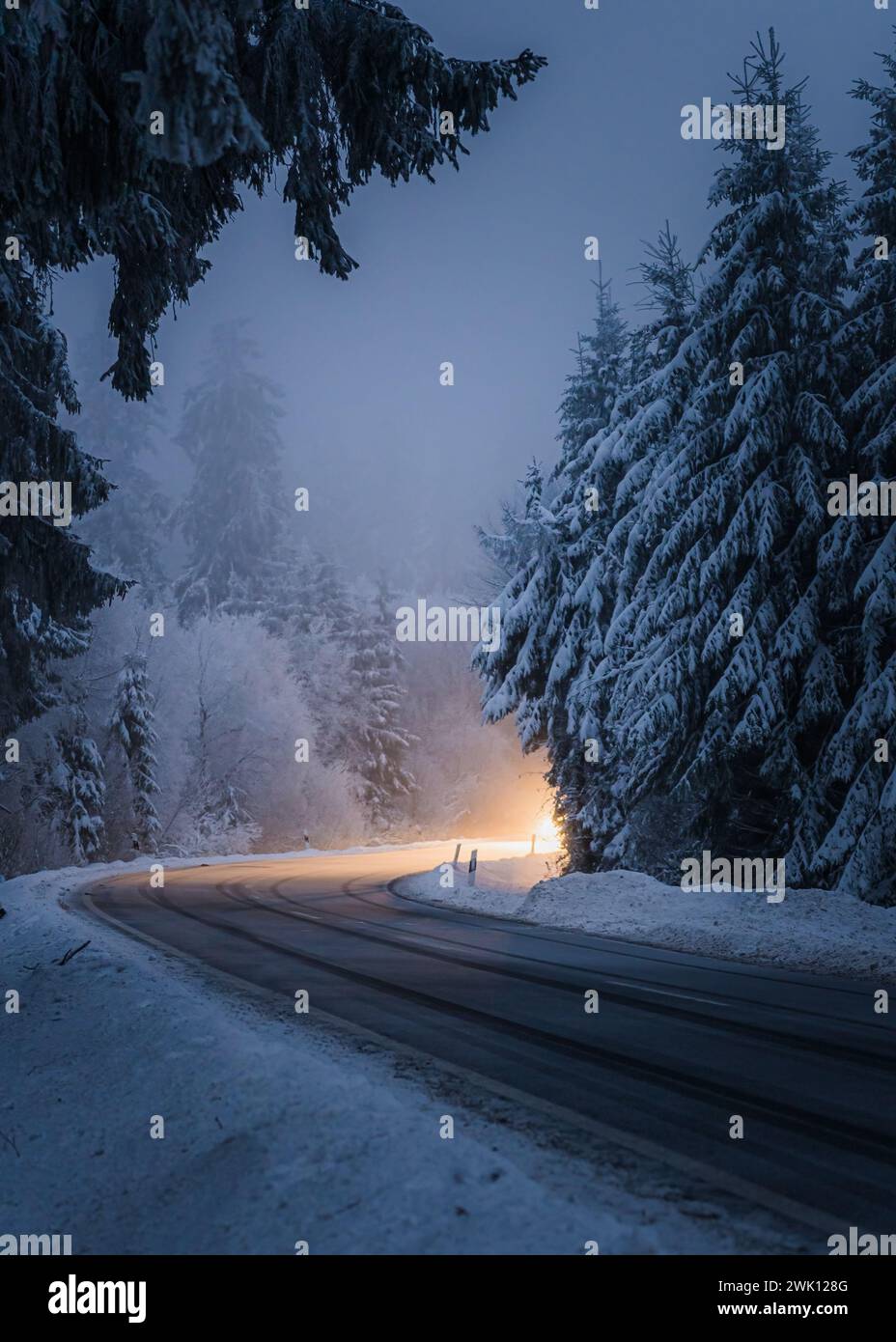 Car driving on a snowy road hi-res stock photography and images - Alamy