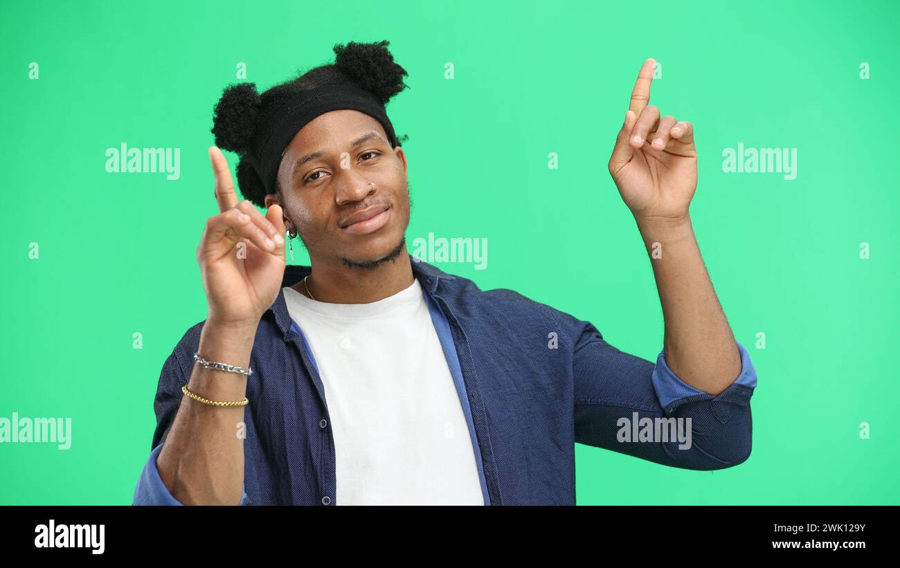 Joyful african man pointing hi-res stock photography and images - Alamy