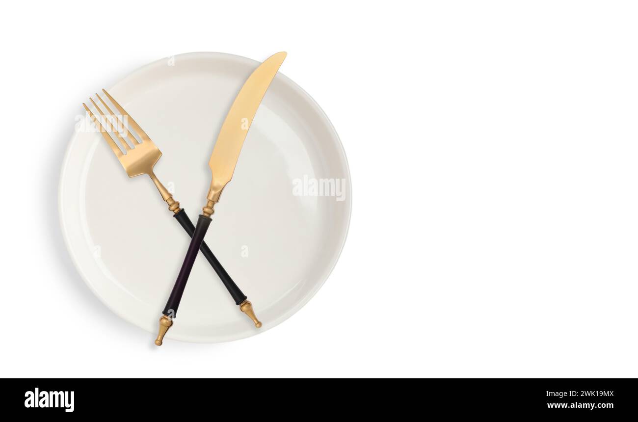 Clean plate, fork and knife on white background, top view Stock Photo ...