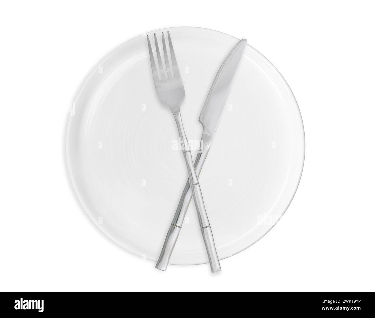 Clean plate, fork and knife on white background, top view Stock Photo ...