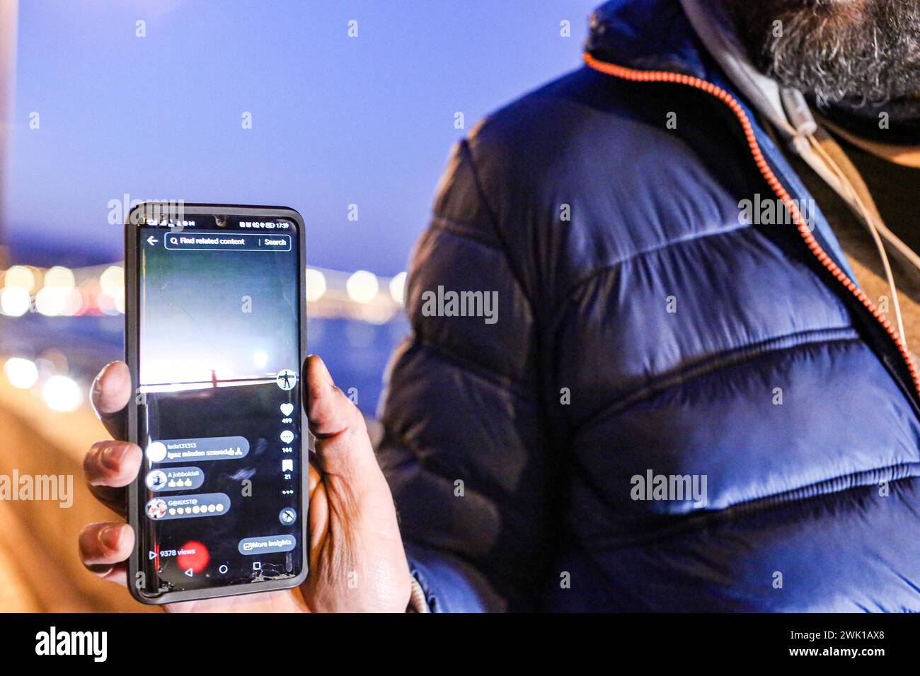 Budapest, Budapest, Hungary. 17th Feb, 2024. Hungarian activist, Balasz T., holds a phone demonstrating efforts by other activists and influencers the day after a massive protest took place in the capital towards Hungarian Prime Minister VIKTOR ORBAN and on the three resignations of Hungarian President, KATALIN NOVAK; former Minister and leadership of Hungarian Reform Church, ZOLTAN BALOG and former Justice Minister, JUDIT VARGA following exposure of a man pardoned last year from covering up pedophilia in a children's home. The reveal has caused embarrassment and tarnished the image of Hu Stock Photo