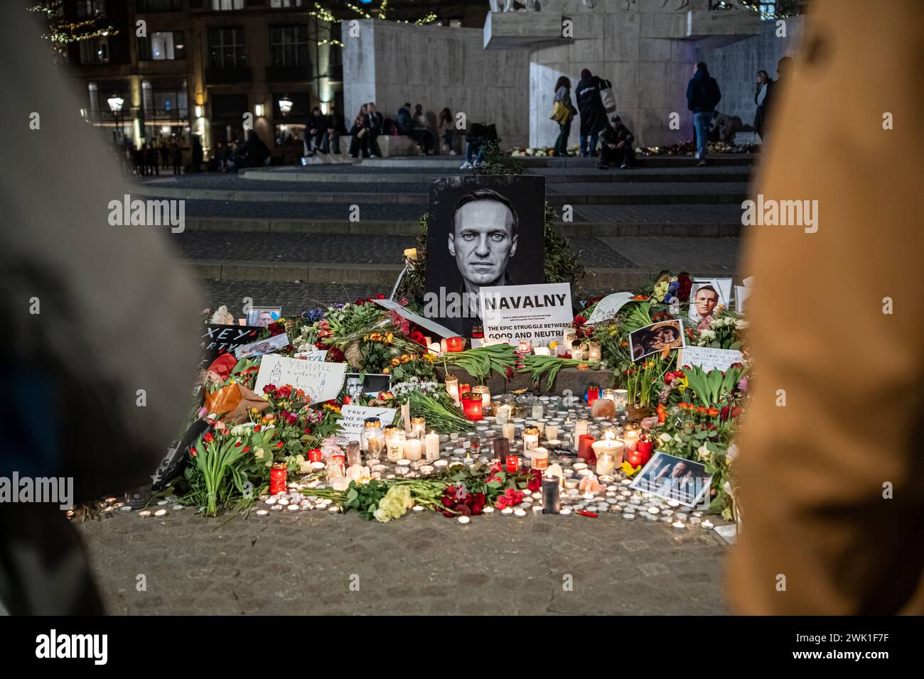 Amsterdam, the Netherlands - February 17, 2024: Makeshift Memorial to Commemorate Death Alexei Navalny at Dam Square with Candles and Flowers Stock Photo